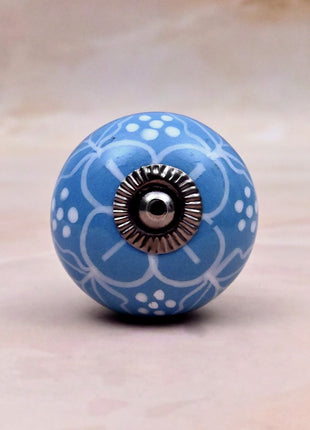 White Design on Turquoise Base Ceramic Door Knob