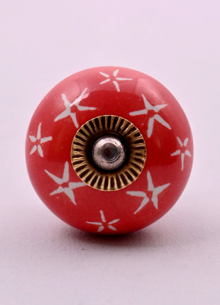 White Starburst on Red Ceramic Door Knob