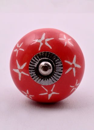 White Starburst on Red Ceramic Door Knob
