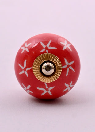 White Starburst on Red Ceramic Door Knob
