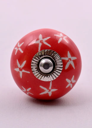 White Starburst on Red Ceramic Door Knob