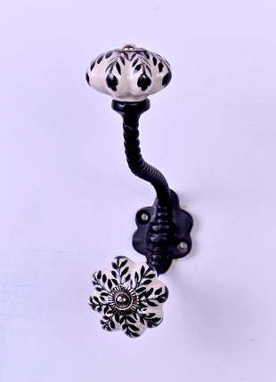 Black Design On White Base Ceramic Knob With Metal Wall Hanger