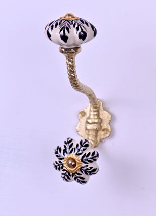 Black Design On White Base Ceramic Knob With Metal Wall Hanger