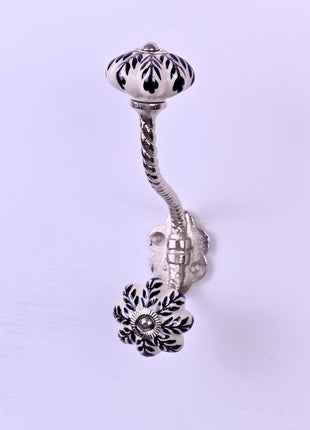 Black Design On White Base Ceramic Knob With Metal Wall Hanger
