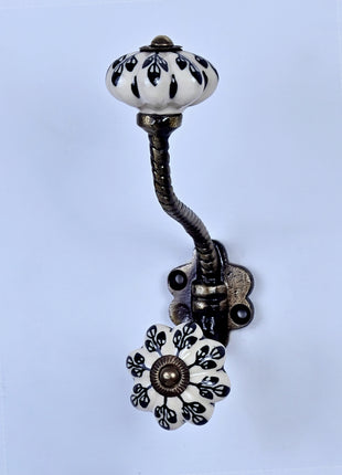 Black Flower Design Off White Base Ceramic Knob With Metal Wall Hanger