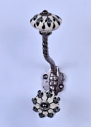 Black Flower Design Off White Base Ceramic Knob With Metal Wall Hanger
