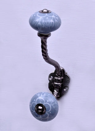 White Floral Pattern on Powder Blue With Metal Wall Hanger