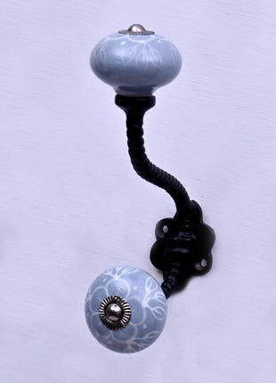 White Floral Pattern on Powder Blue With Metal Wall Hanger