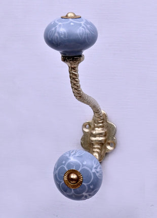 White Floral Pattern on Powder Blue With Metal Wall Hanger