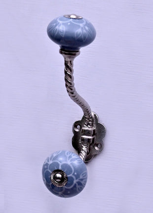 White Floral Pattern on Powder Blue With Metal Wall Hanger