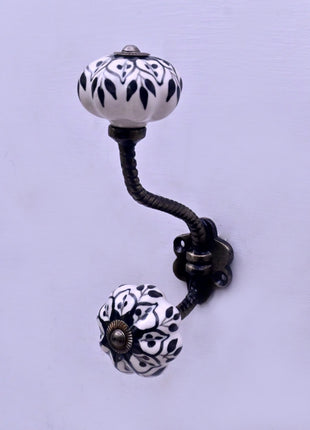 Black Design on White Ceramic Knob With Metal Wall Hanger