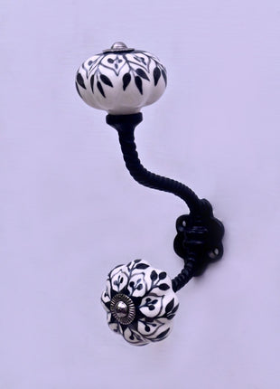 Black Design on White Ceramic Knob With Metal Wall Hanger