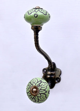 Black Design on Green Ceramic Knob With Metal Wall Hanger