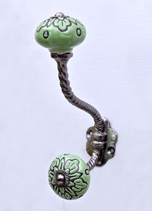 Black Design on Green Ceramic Knob With Metal Wall Hanger