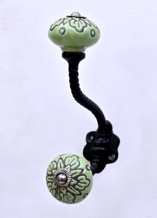 Black Design on Green Ceramic Knob With Metal Wall Hanger