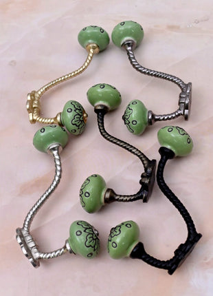 Black Design on Green Ceramic Knob With Metal Wall Hanger