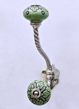 Black Design on Green Ceramic Knob With Metal Wall Hanger