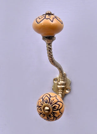 Black Design on Yellow Ceramic Knob With Metal Wall Hanger