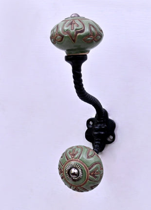 Dark Brown Design on Green Ceramic Knob With Metal Wall Hanger