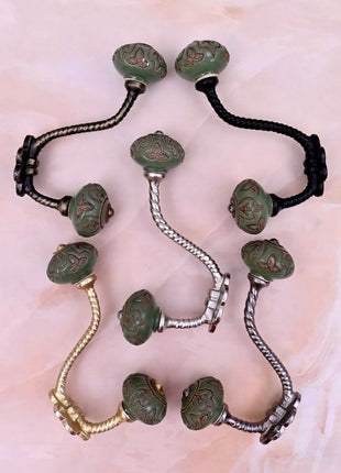 Dark Brown Design on Green Ceramic Knob With Metal Wall Hanger