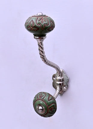 Dark Brown Design on Green Ceramic Knob With Metal Wall Hanger