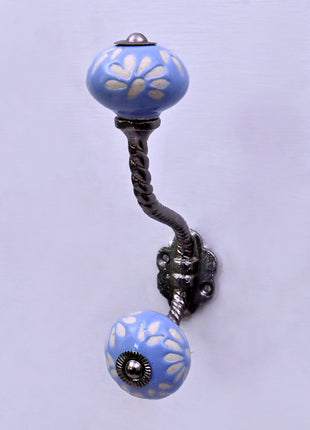 White Design on Soft Powder Blue Ceramic Knob With Metal Wall Hanger