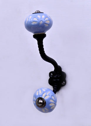 White Design on Soft Powder Blue Ceramic Knob With Metal Wall Hanger