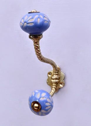 White Design on Soft Powder Blue Ceramic Knob With Metal Wall Hanger