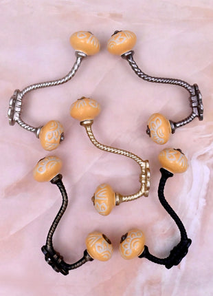 Yellow Embossed Ceramic Knob With Metal Wall Hanger