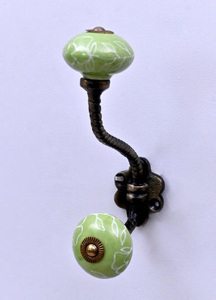 White Outline on Green Base Ceramic Knob With Metal Wall Hanger