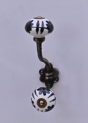 Black Design On White Ceramic Knob With Metal Wall Hanger