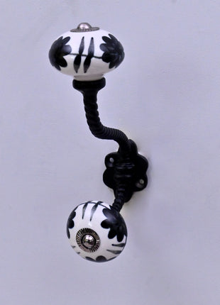 Black Design On White Ceramic Knob With Metal Wall Hanger