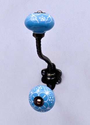White Design on Turquoise Base Ceramic Knob With Metal Wall Hanger