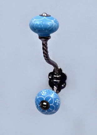 White Design on Turquoise Base Ceramic Knob With Metal Wall Hanger
