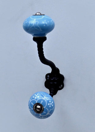 White Design on Turquoise Base Ceramic Knob With Metal Wall Hanger