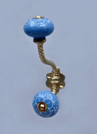 White Design on Turquoise Base Ceramic Knob With Metal Wall Hanger