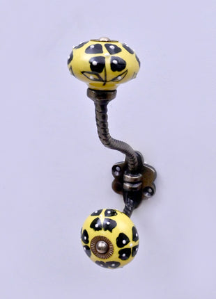 Black Flowers Design on Yellow Base Ceramic Knob With Metal Wall Hanger