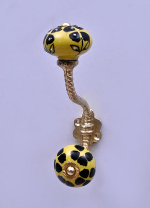 Black Flowers Design on Yellow Base Ceramic Knob With Metal Wall Hanger