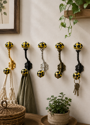 Black Flowers Design on Yellow Base Ceramic Knob With Metal Wall Hanger