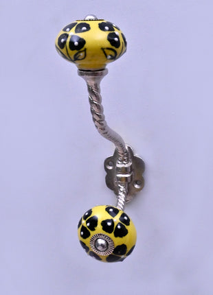 Black Flowers Design on Yellow Base Ceramic Knob With Metal Wall Hanger