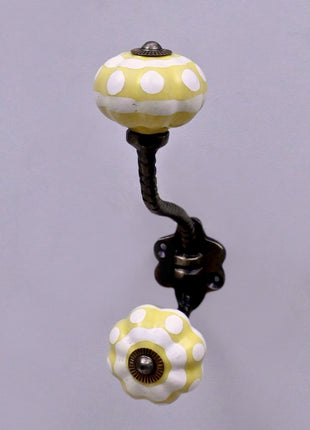 Yellow and White Ceramic Knob With Metal Wall Hanger