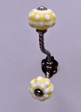 Yellow and White Ceramic Knob With Metal Wall Hanger