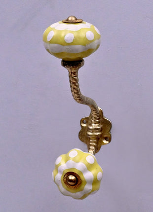Yellow and White Ceramic Knob With Metal Wall Hanger