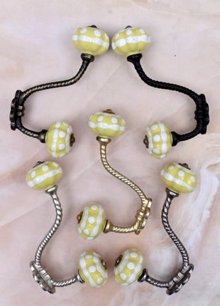 Yellow and White Ceramic Knob With Metal Wall Hanger