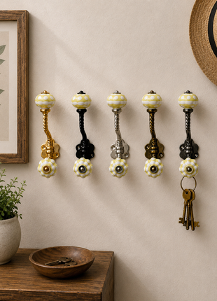 Yellow and White Ceramic Knob With Metal Wall Hanger
