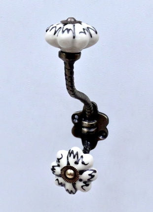 Black Design on Off White Ceramic Melon Knob With Metal Wall Hanger