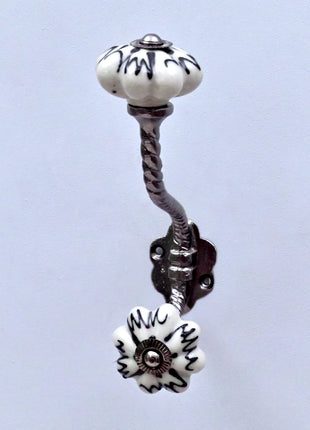 Black Design on Off White Ceramic Melon Knob With Metal Wall Hanger