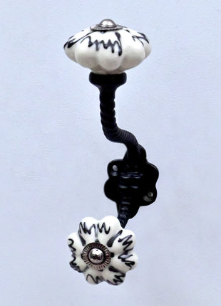 Black Design on Off White Ceramic Melon Knob With Metal Wall Hanger
