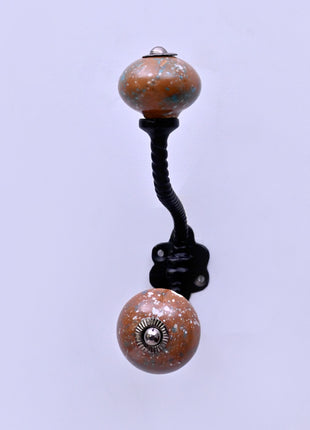 White Speckled Pattern on Rustic Brown Ceramic Knob With Metal Wall Hanger