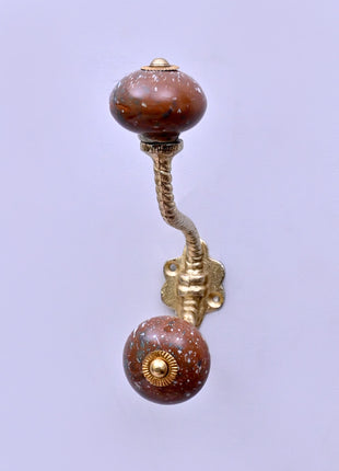 White Speckled Pattern on Rustic Brown Ceramic Knob With Metal Wall Hanger